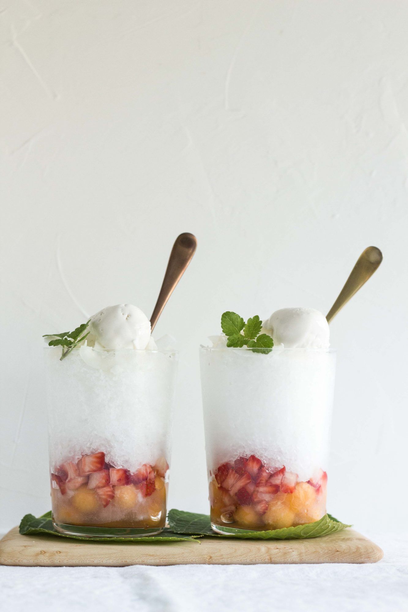 Two glasses on a serving board