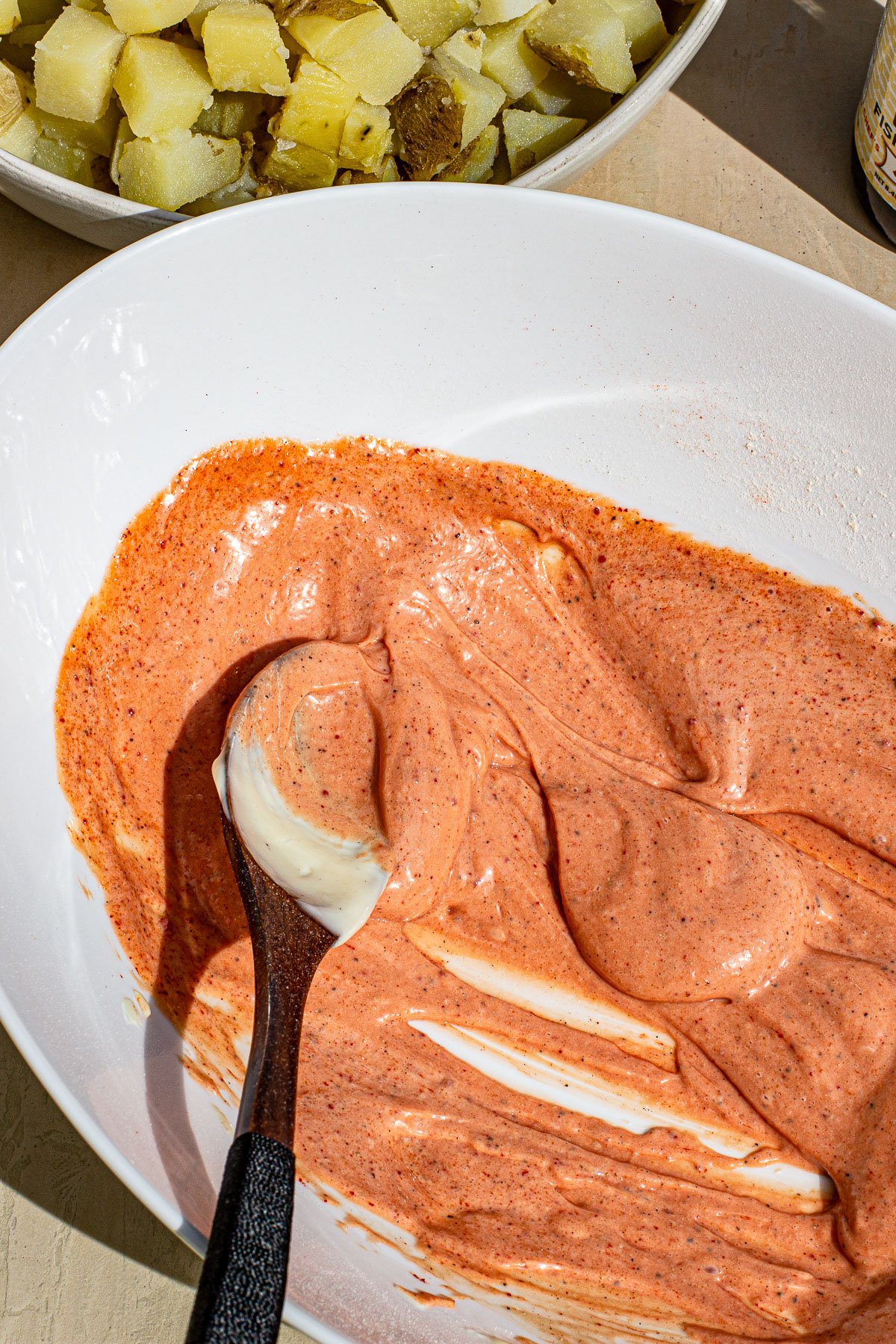 Palabok Potato salad dressing mixed in a bowl.