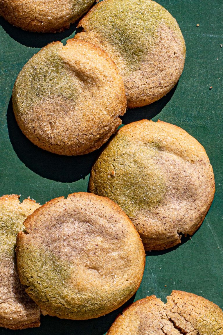 Filipino Neapolitan Sugar Cookies Filled with Yema on a green backdrop.