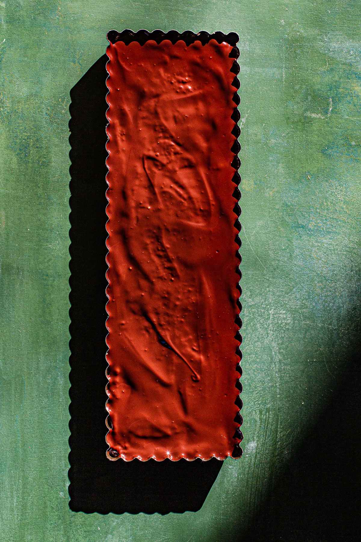 Millonariyo Bars (Filipino Style Millionaire Bars) All on a green background.