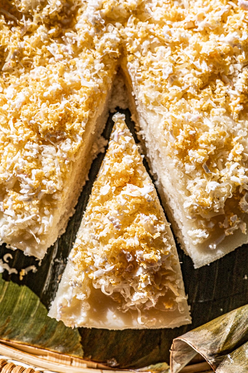 Slice of Puto Biñan up close on a banana leaf.
