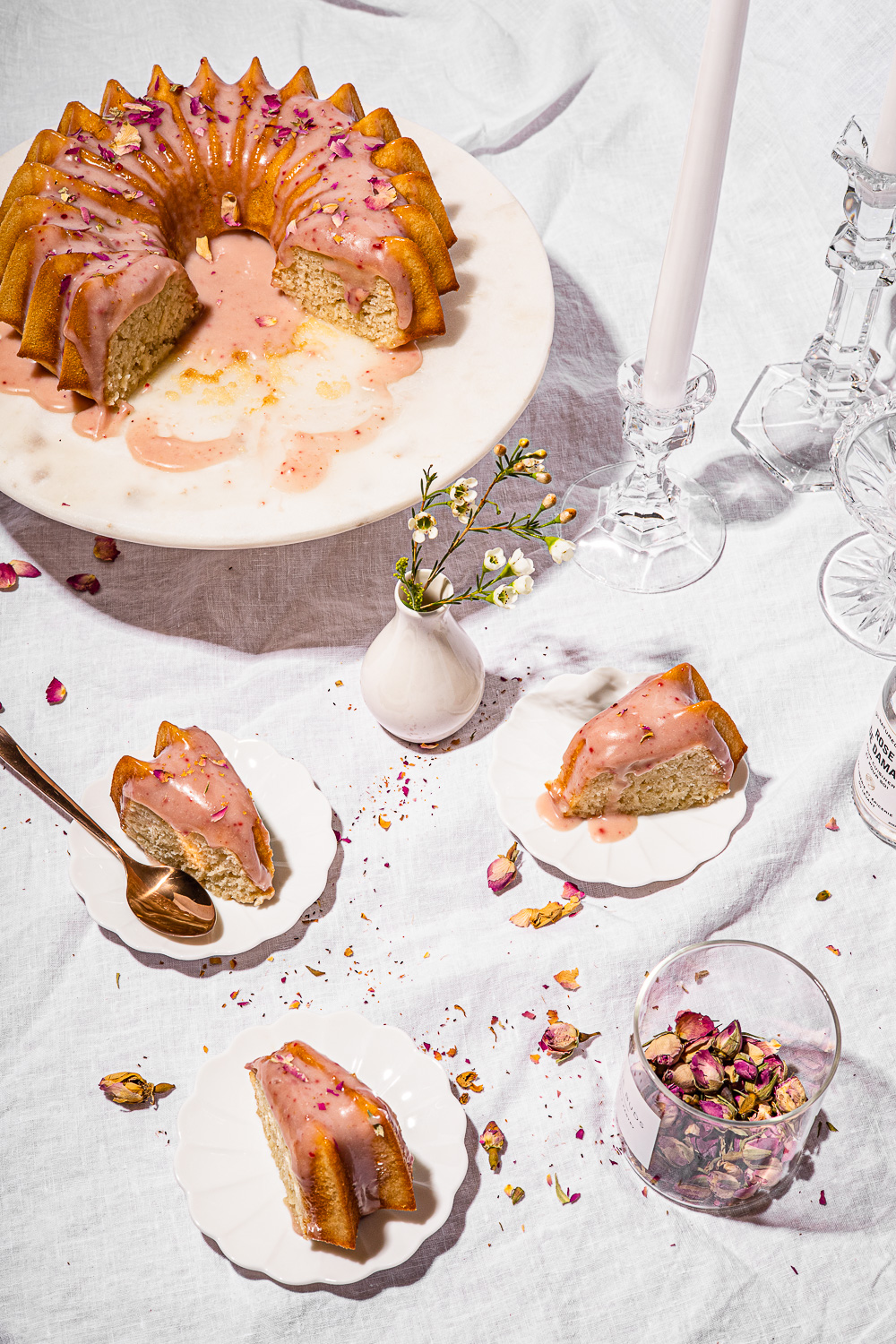 slices of Ispahan Cake on white linen table cloth.