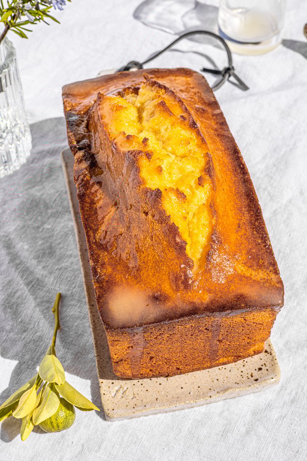Top down view of Kalamansi Pound Cake on a ceramic cutting board.