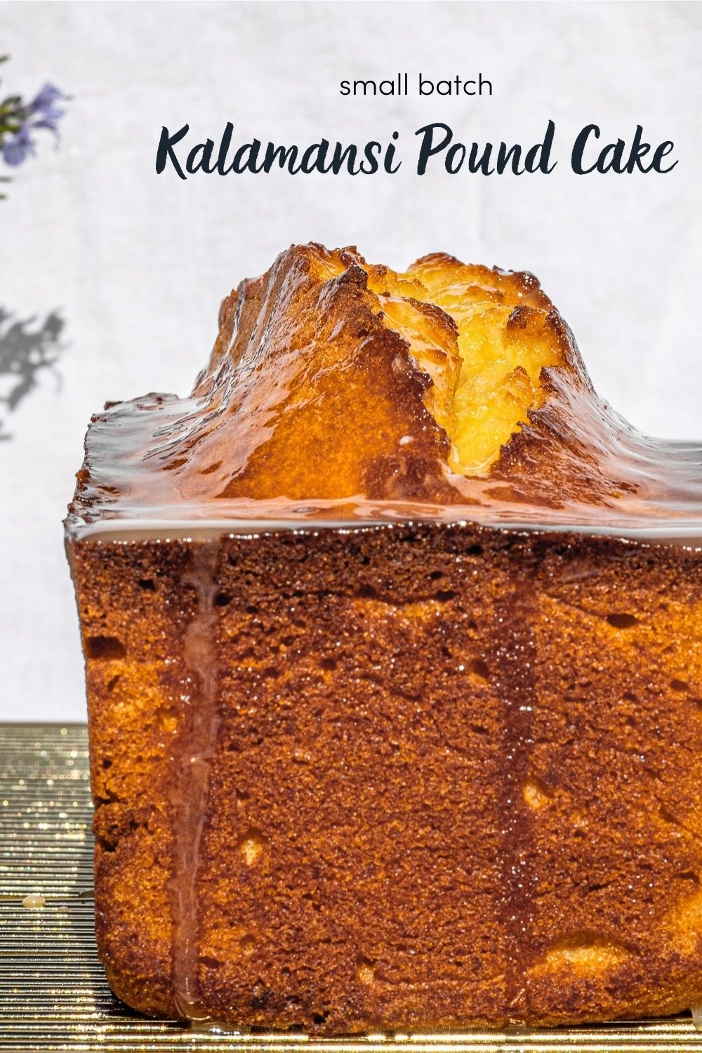 Kalamansi Pound Cake on a gold wire rack.