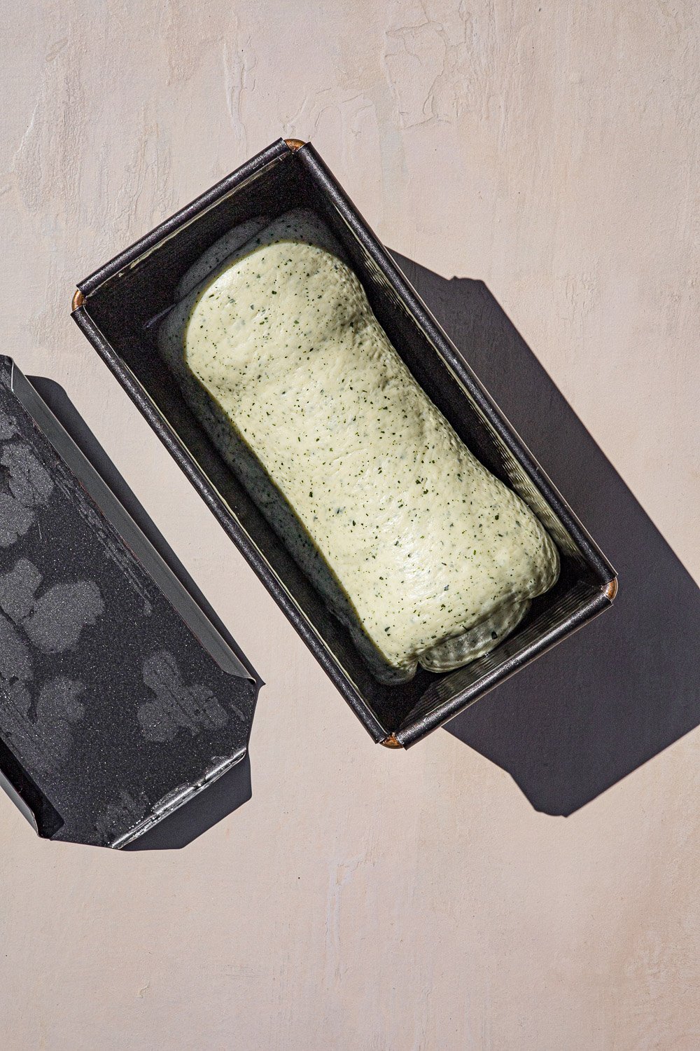 Raw Malunggay bread dough in a loaf tin.