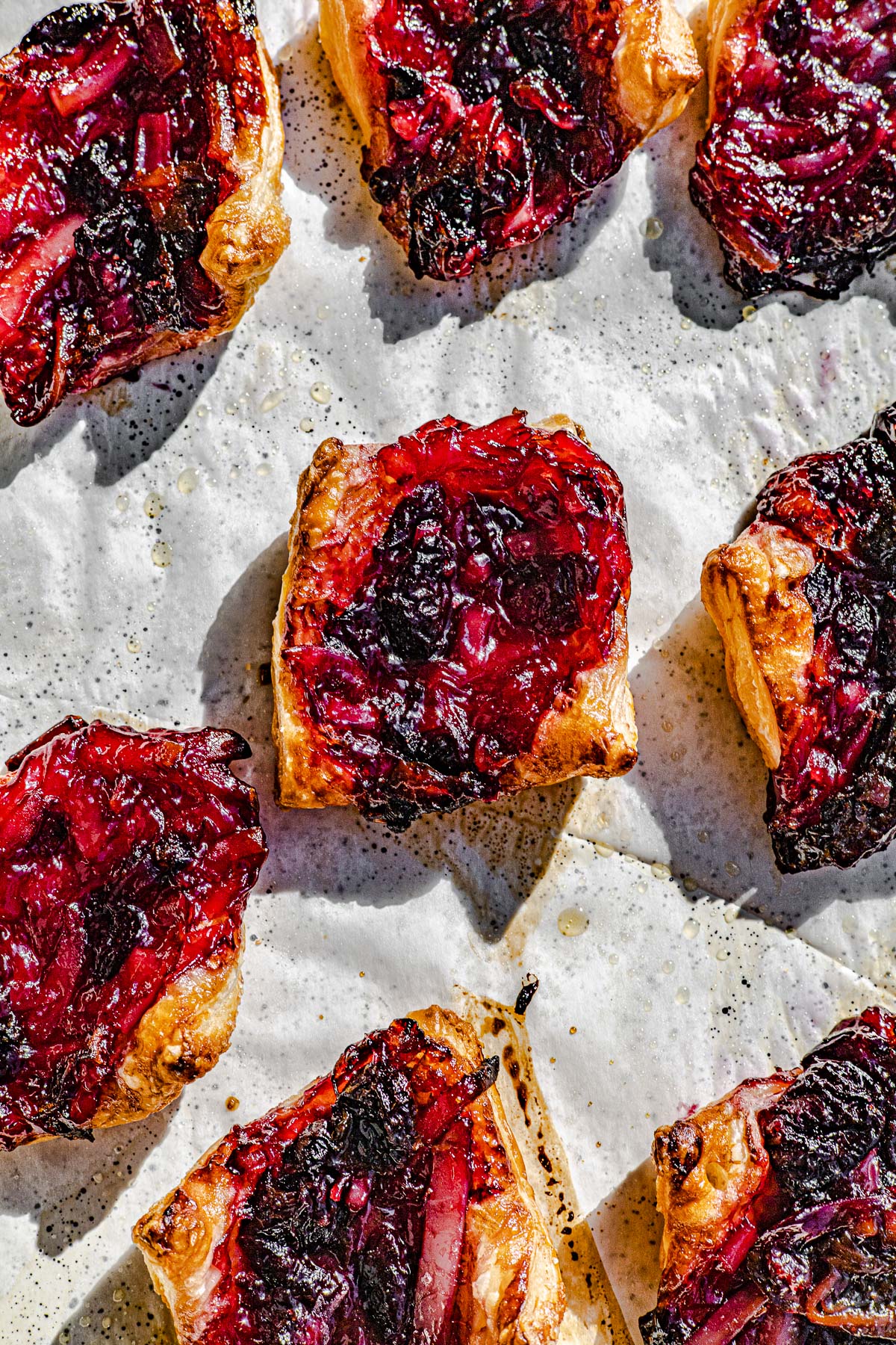 Just out of the oven Cherry Macapuno Pies on a baking tray.  