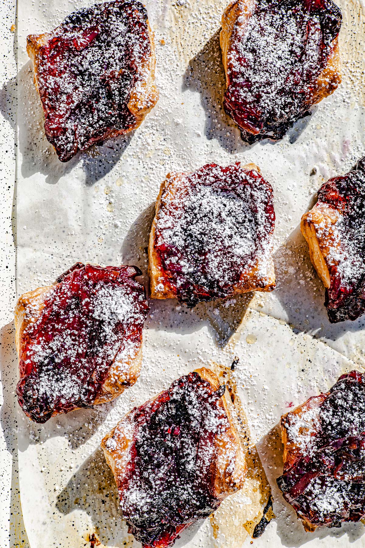 Pies dusted with powdered sugar.