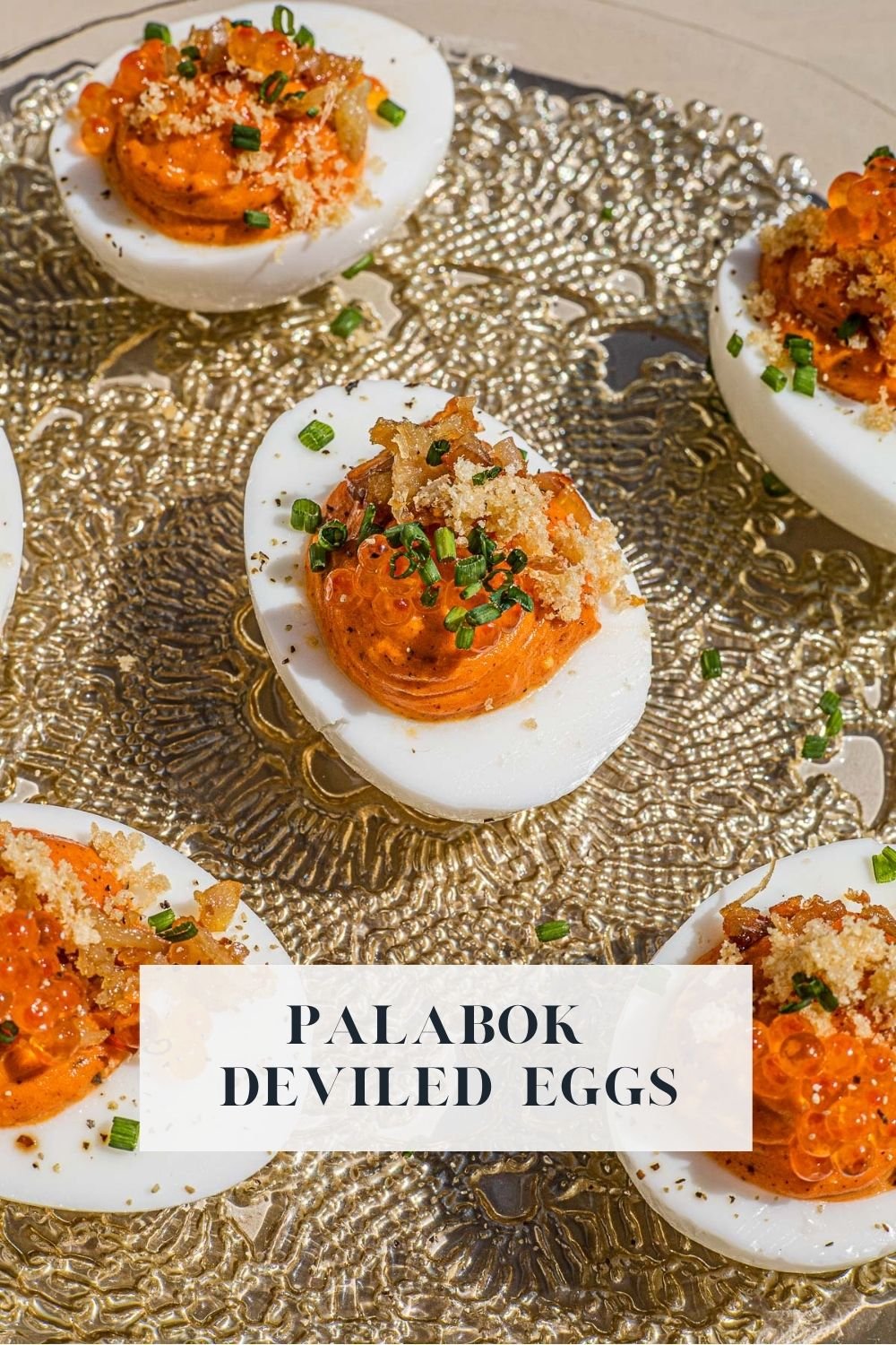 Palabok Deviled Eggs on a glass plate.