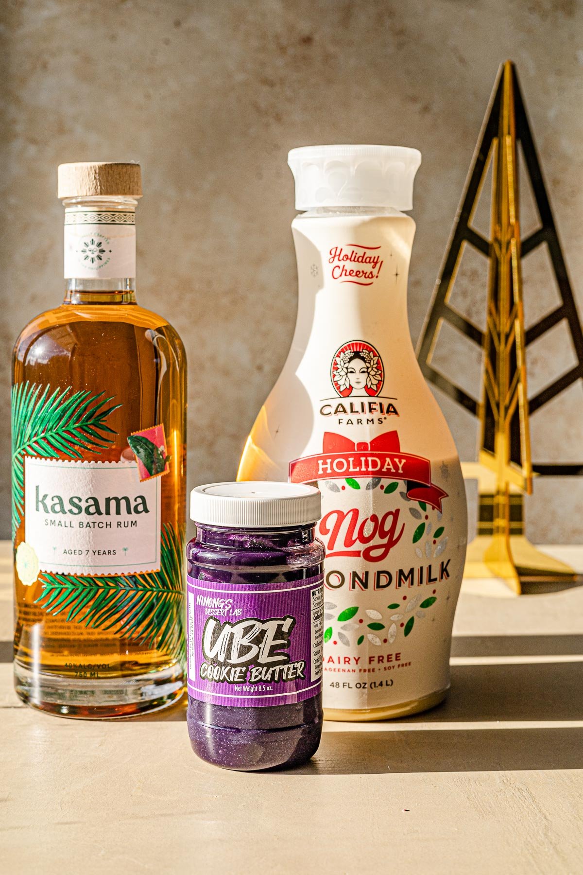 Bottle of Kasama Rum, Bottle of Almond Eggnog and bottle of Ube Cookie Butter.