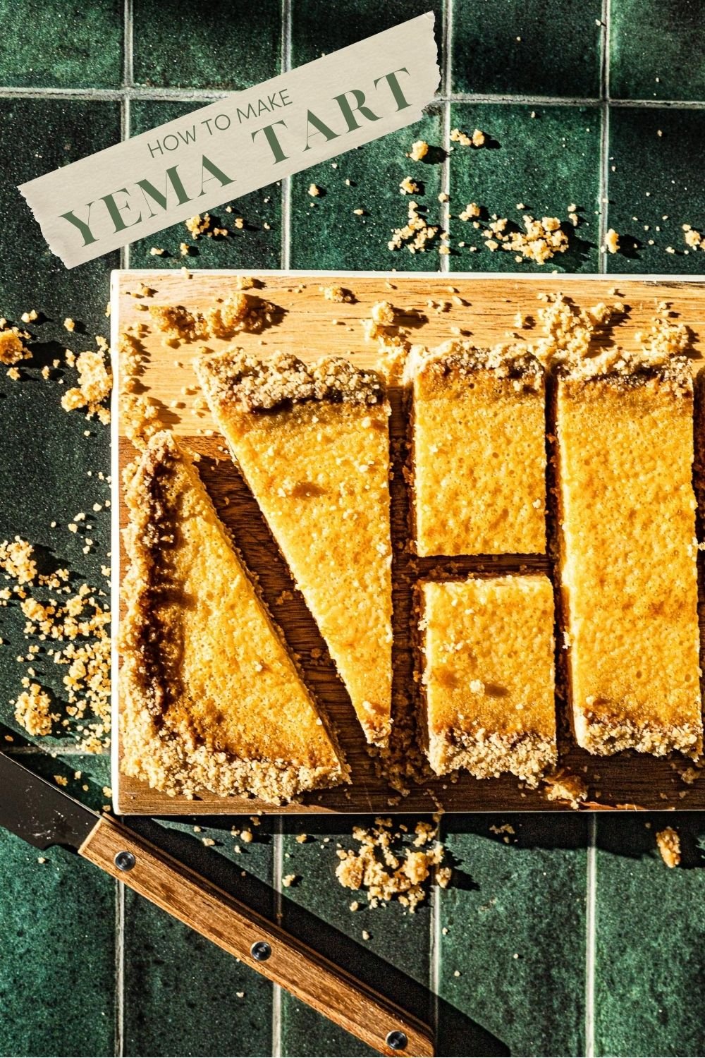 Yema Tart cut into pieces on a wooden cutting board.