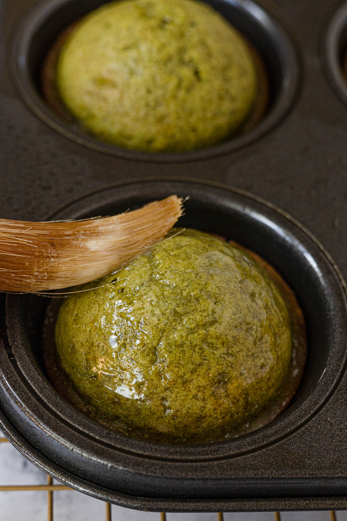 Matcha Kababayan being brushed with melted butter.