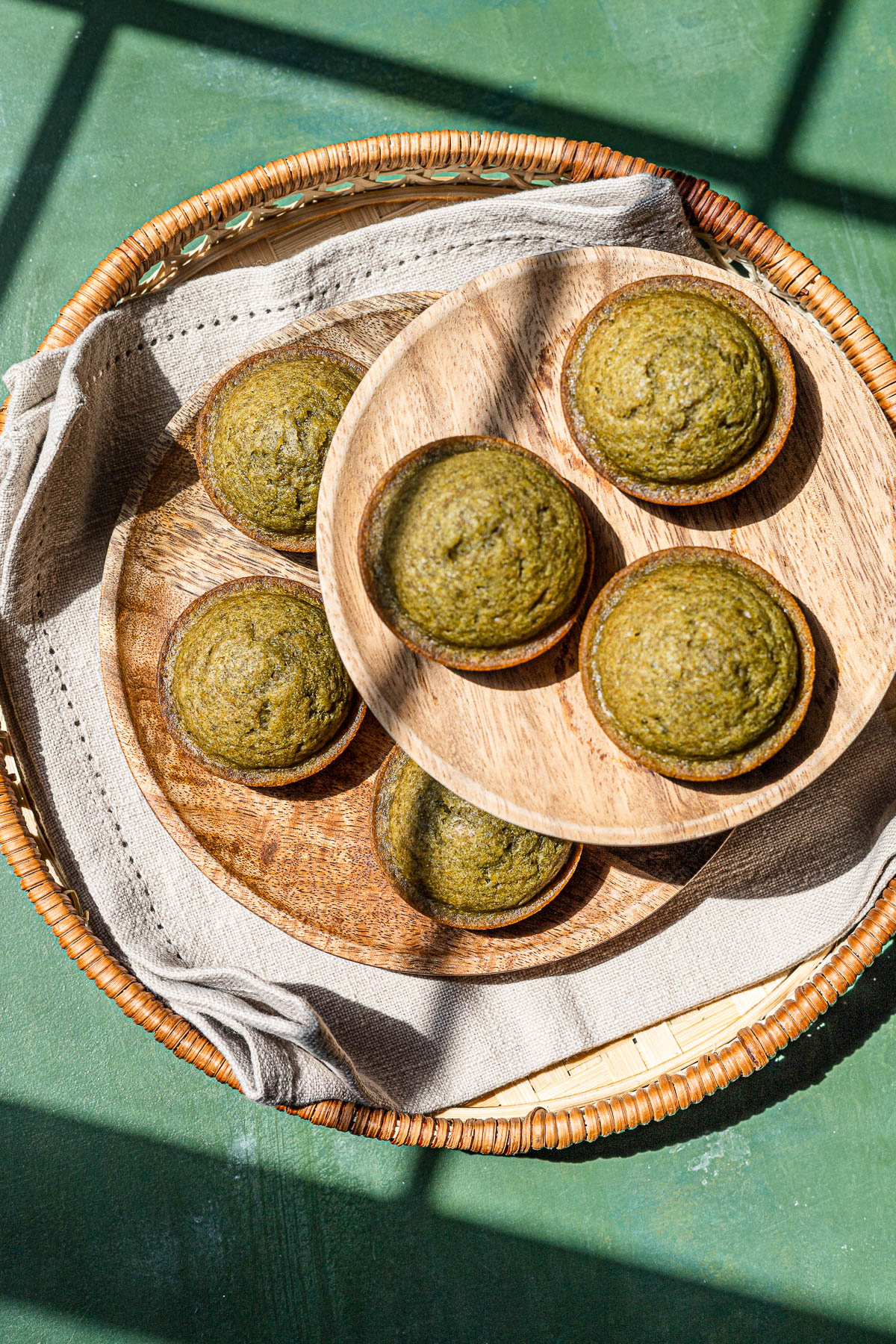 Matcha Kababayan on a plate and cake stand.