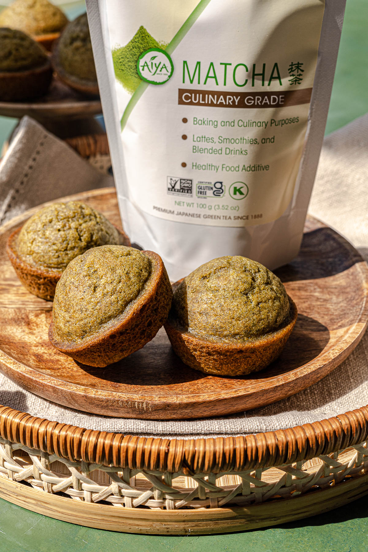 Matcha Kababayan on a brown wooden plate with a bag of Aiya Culinary Grade Matcha