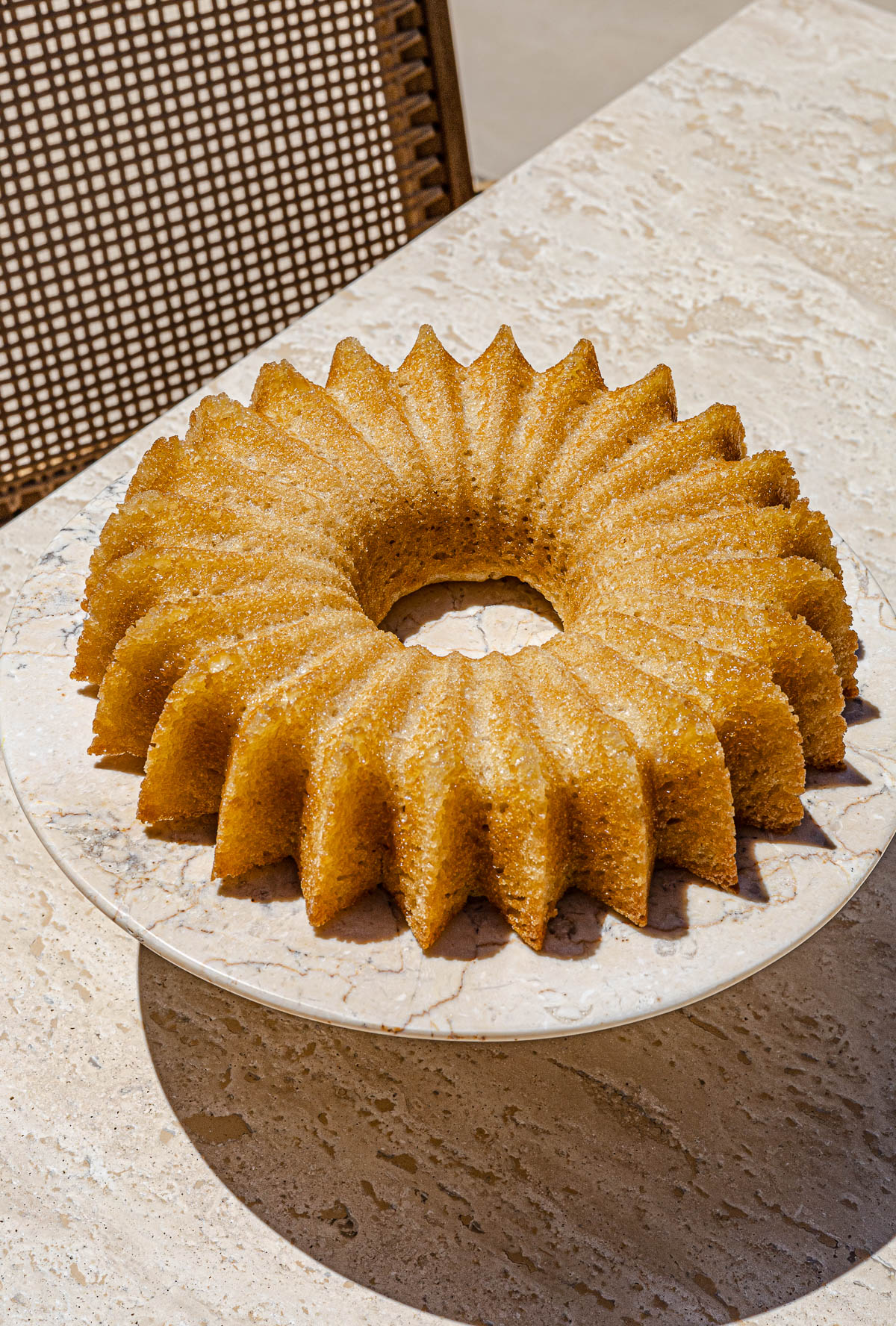 Unglazed mango cake on marble table.