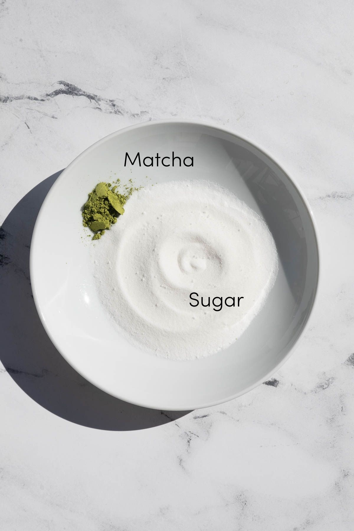 Matcha and sugar in a bowl.