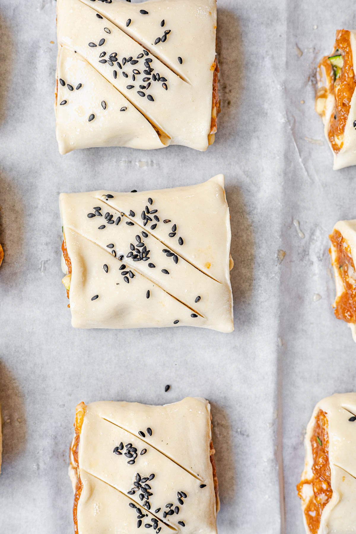 sliced Longanisa Sausage Rolls on a baking sheet