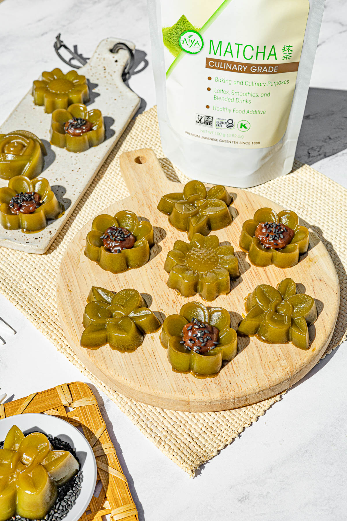 Matcha Kuchinta on a small ceramic serving board and wooden board along with a bag of Aiya Culinary Grade Matcha.