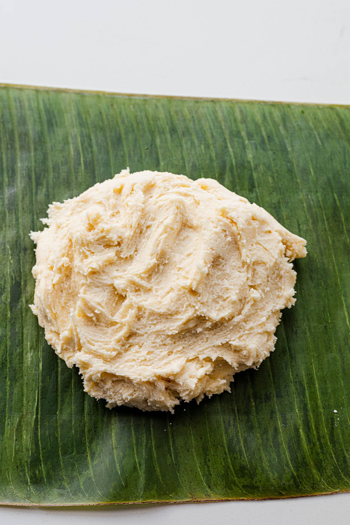 Bibingka cookie dough on top of a banana leaf