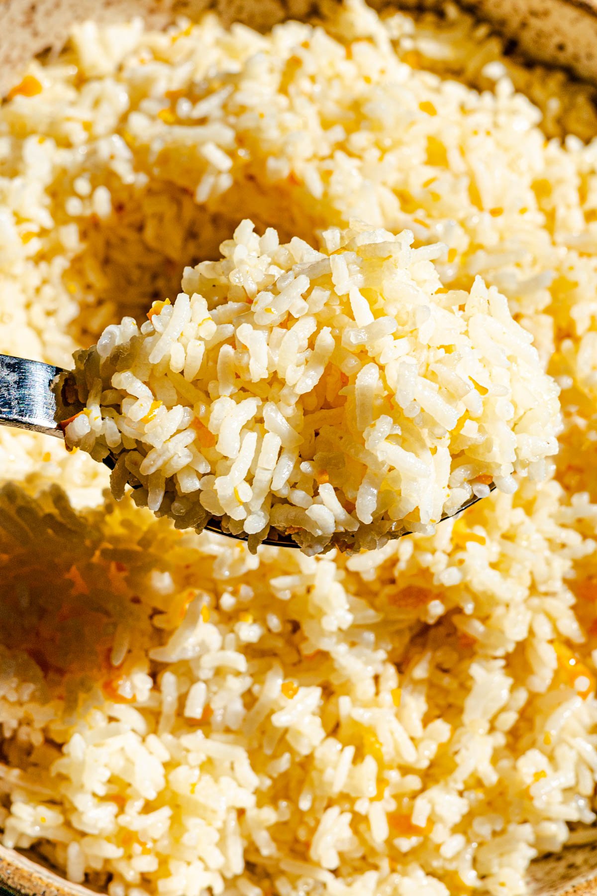 Calamansi Truffle Soy Butter Rice on a spoon.