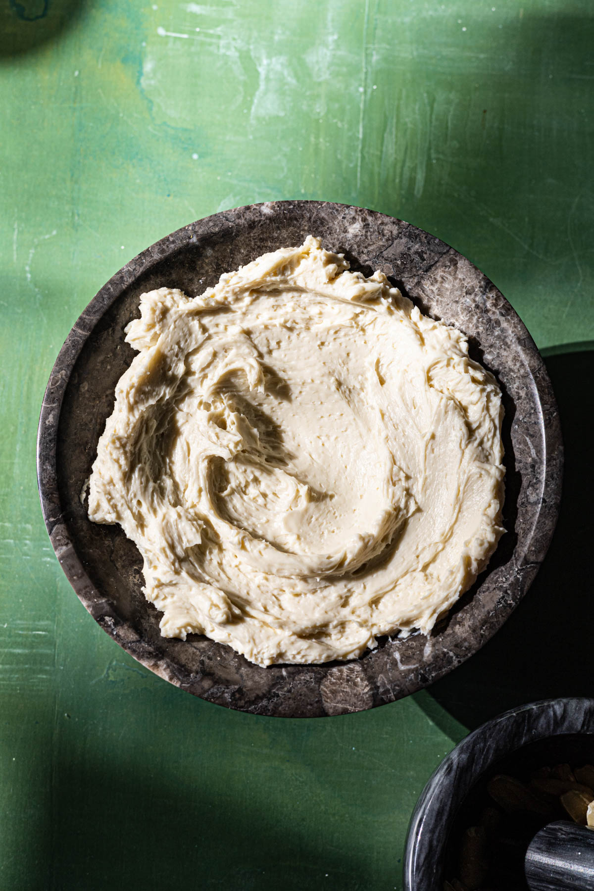Whipped Kesong Puti in a marble serving bowl.