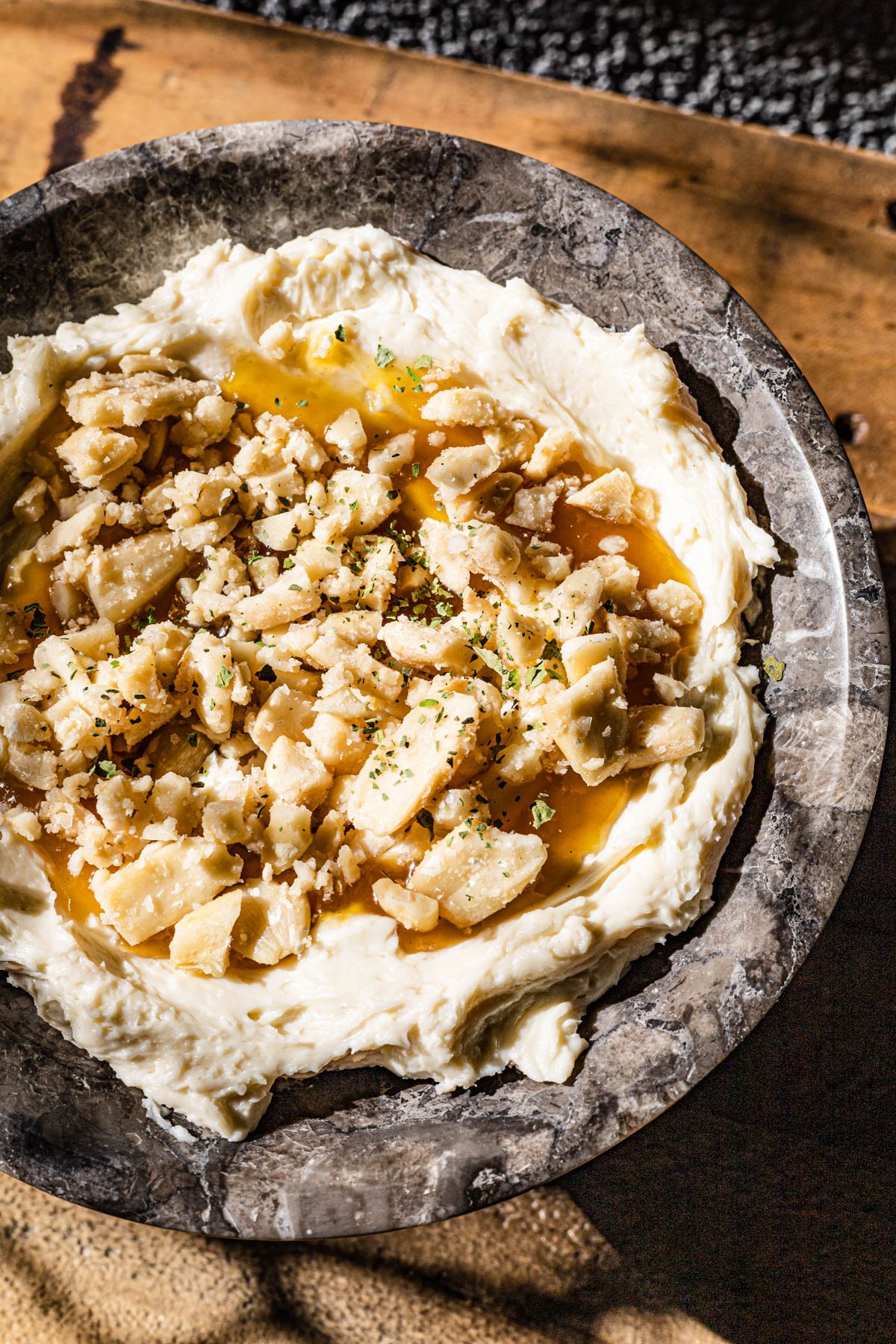 Whipped Kesong Puti with calamansi marmalade and pili nuts.