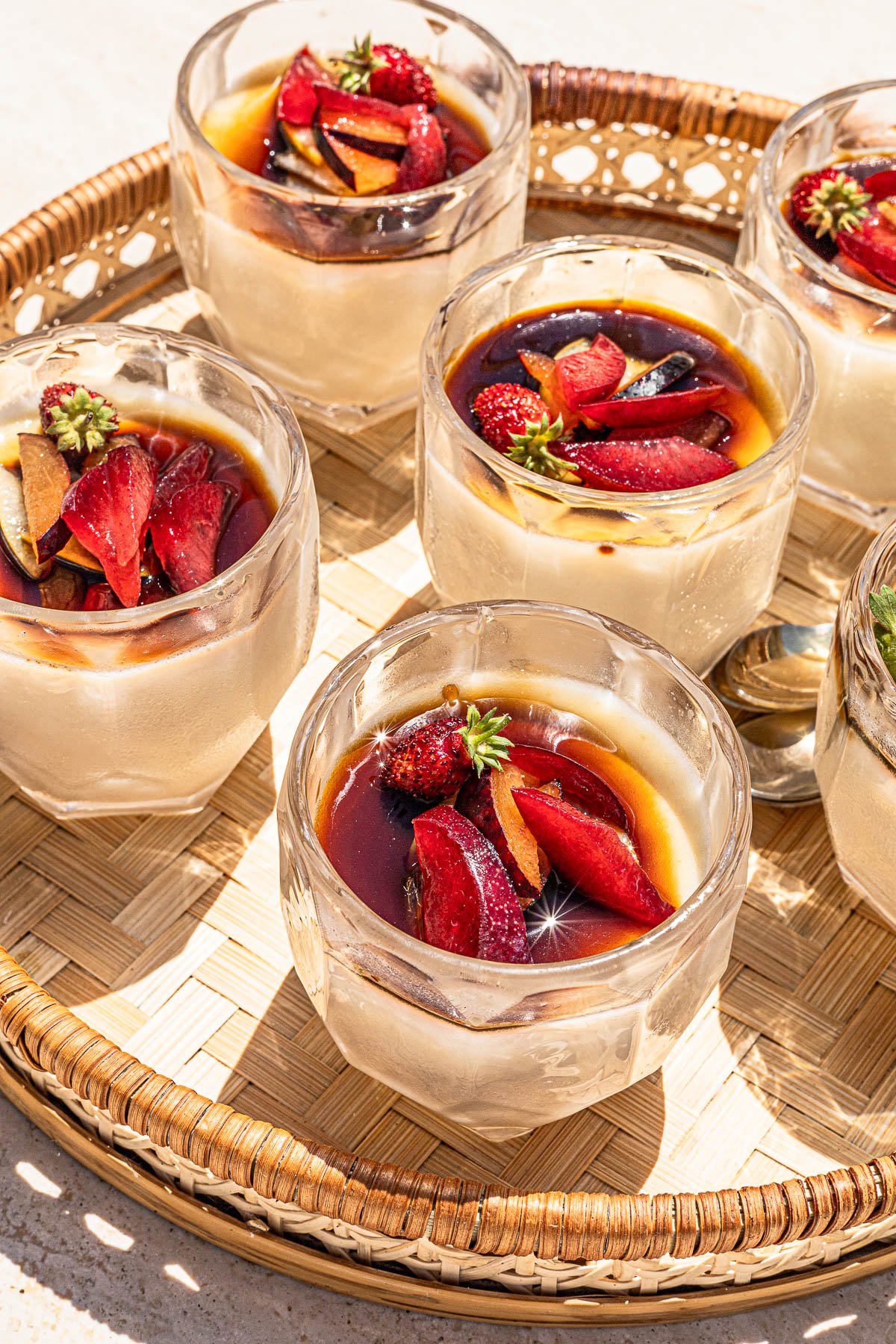 Glasses of chilled Almond Jelly with Tofu in a rattan tray.