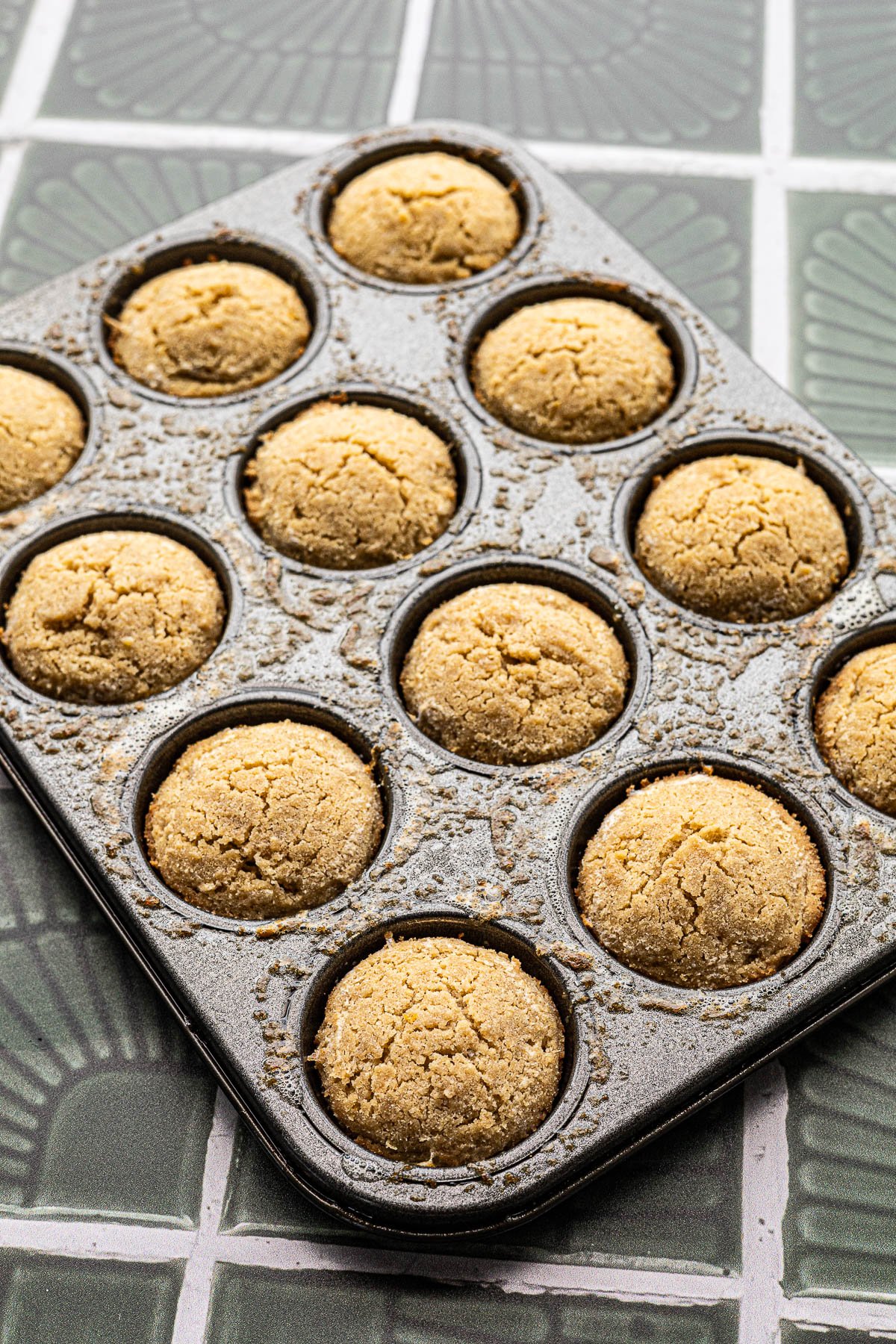 Just baked cookies cooling in mini muffin tin.