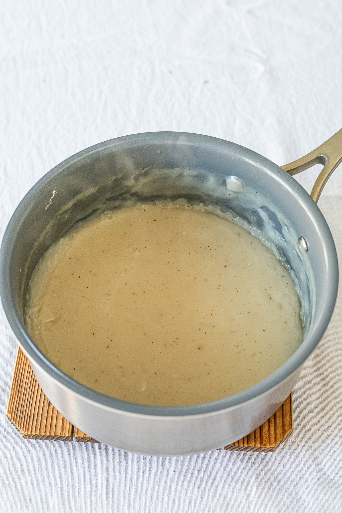Just cooked Maja Blanca Pudding / Vegan Pastry cream in a sauce pan.