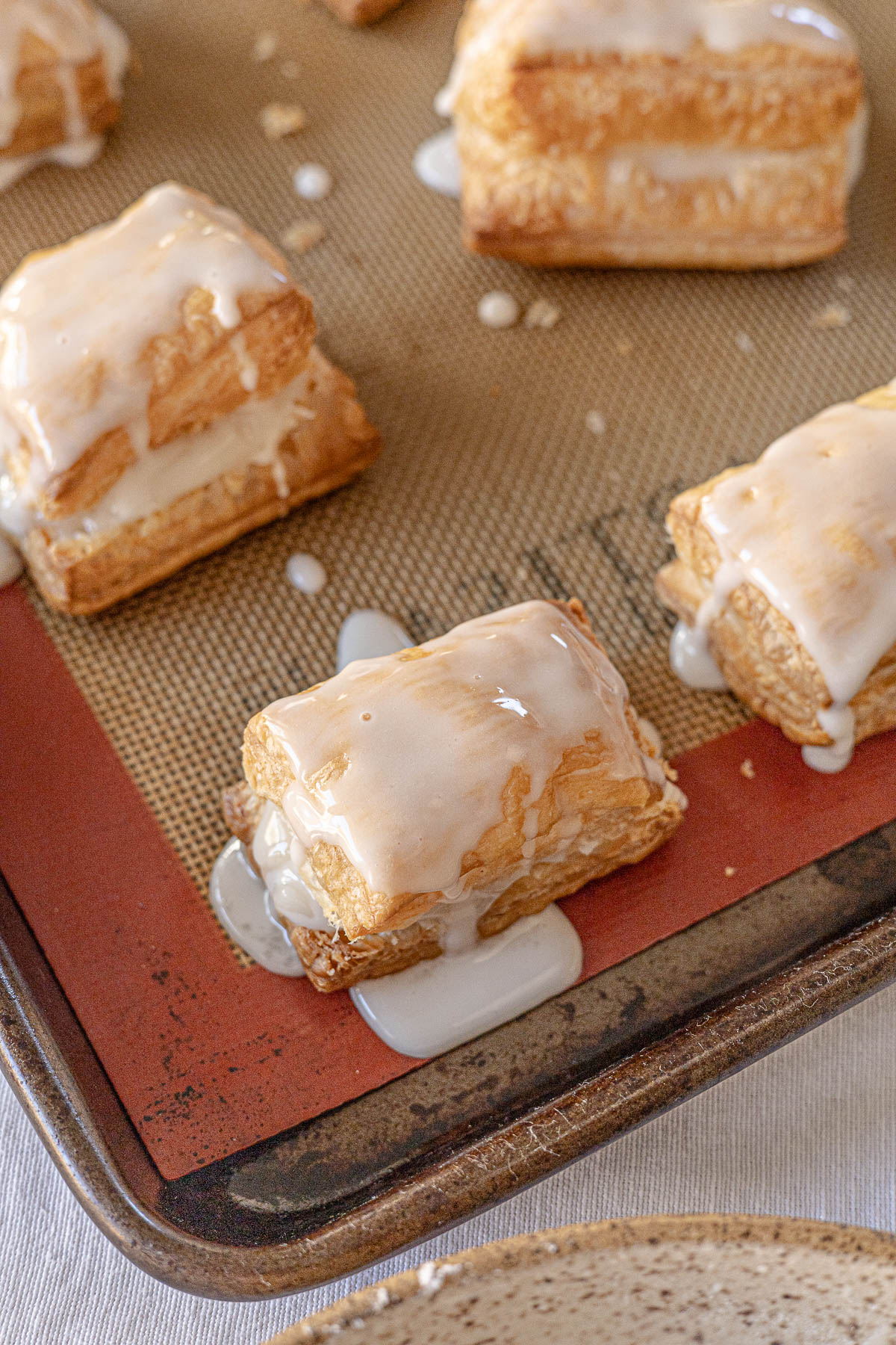 Glazed Napoleones on a baking sheet