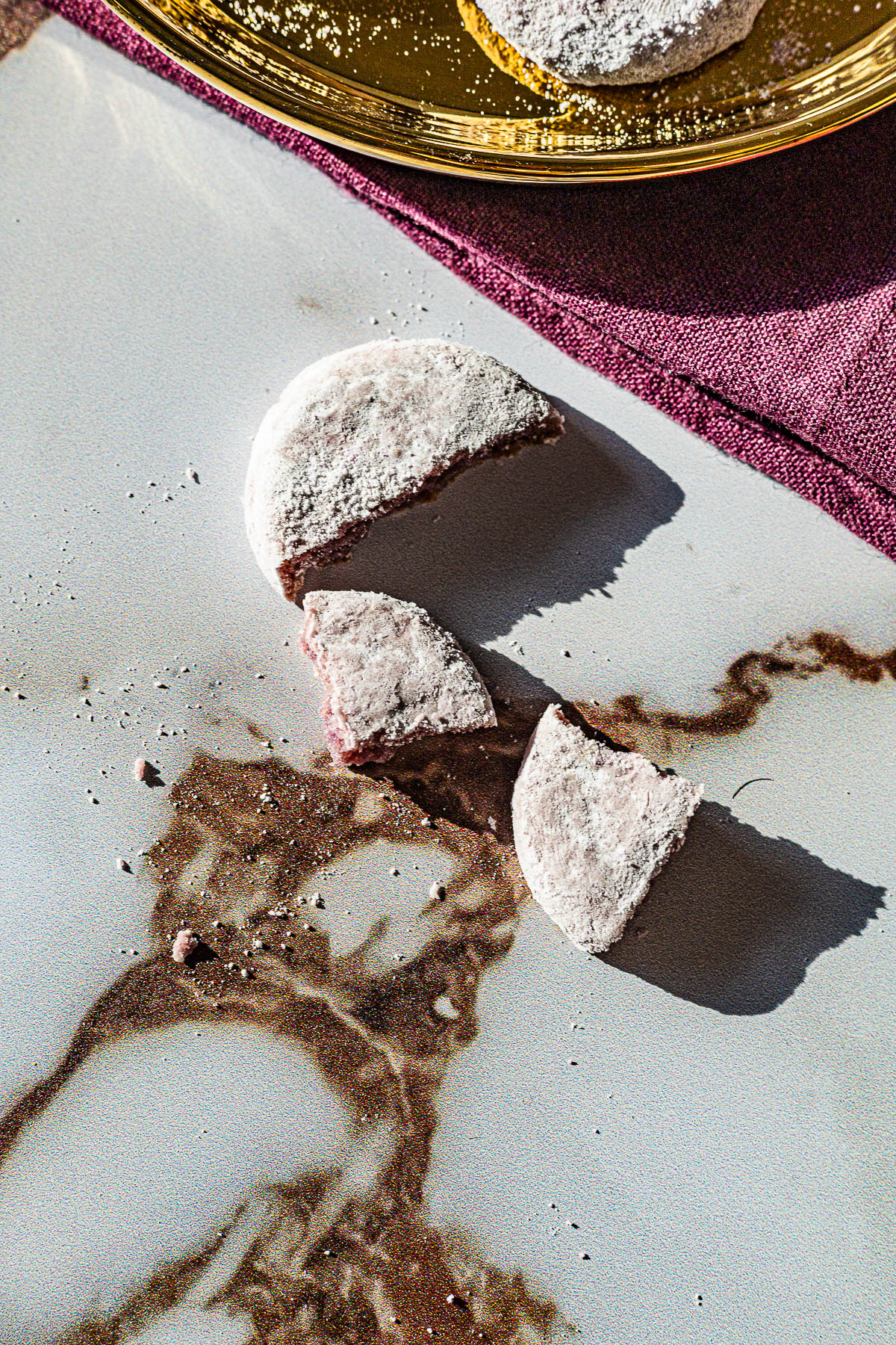 Broken pieces of cookie on a countertop. 