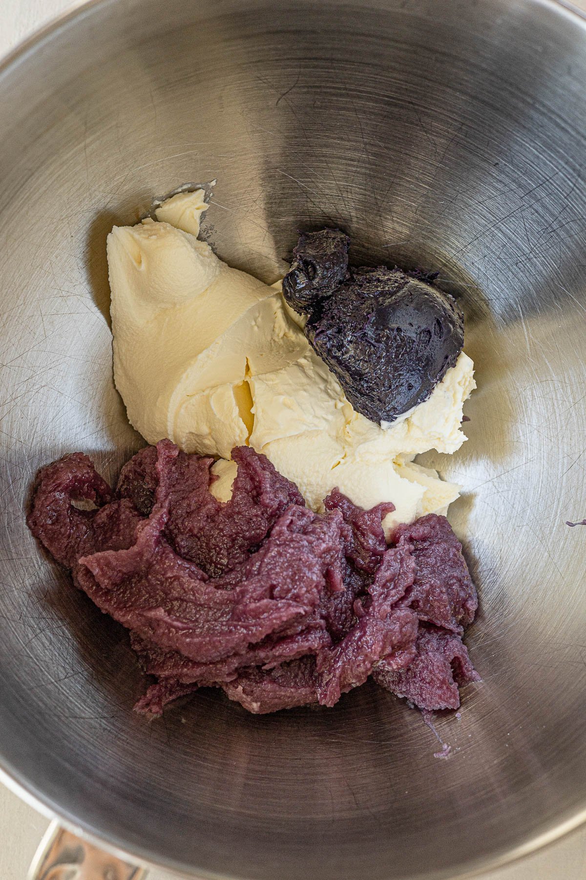 Ube halaya, mascapone cream and ube cookie butter in a mixing bowl