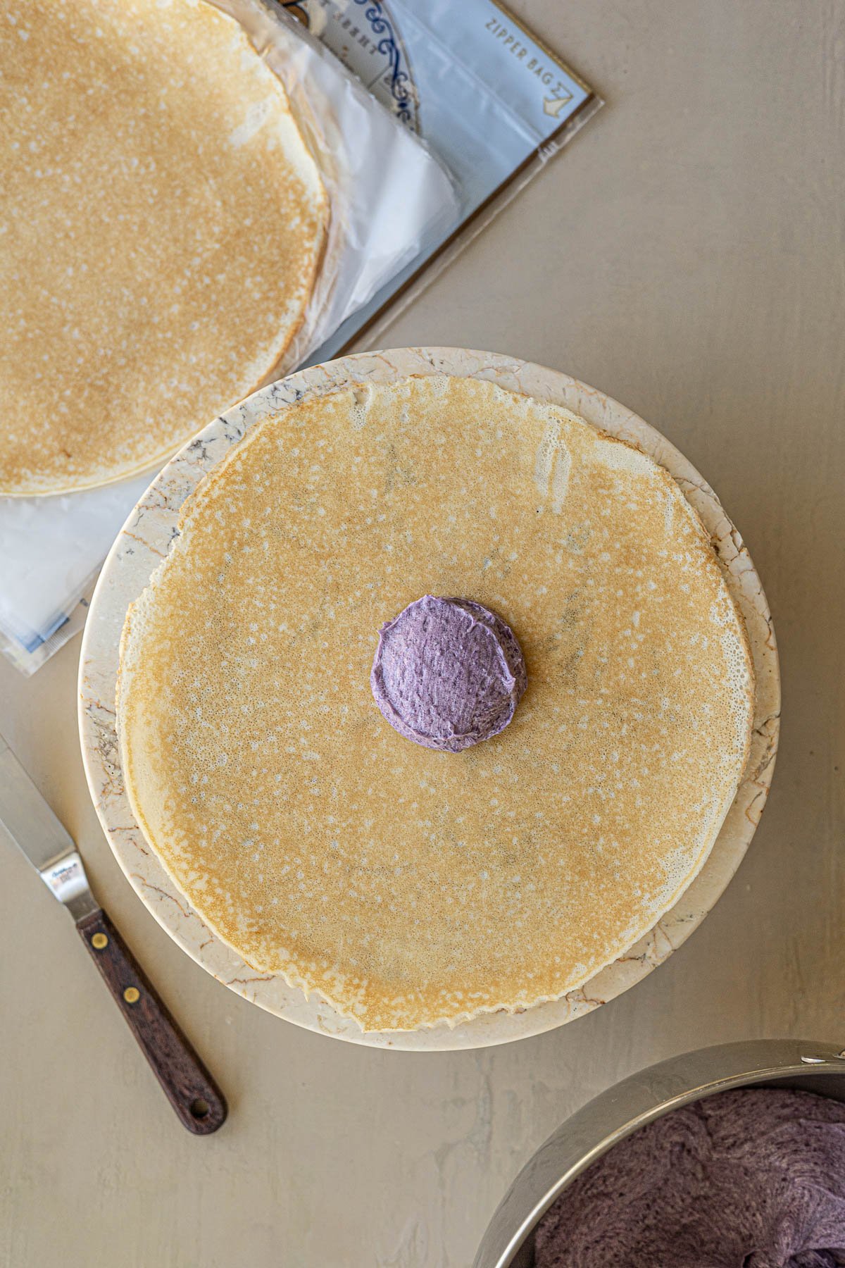 crepe with a scoop of ube creme in the middle