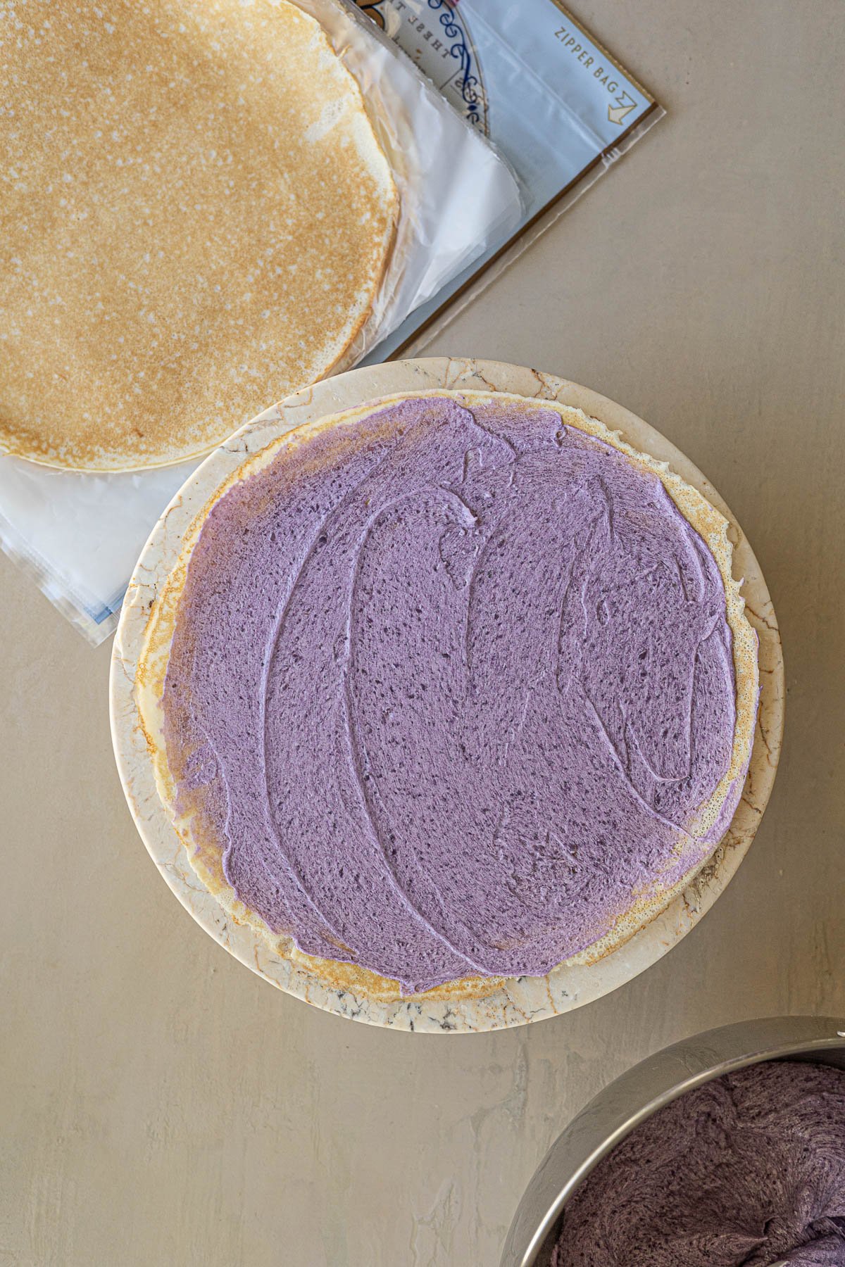 Layer Ube creme and crepes